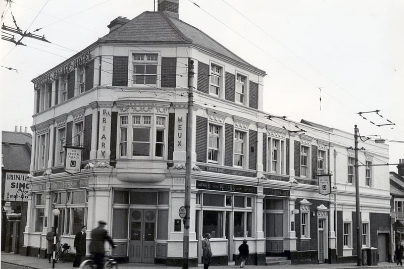 The Crystal Palace at Fratton Bridge
Sent in by Bill Dodd of Portchester and firstly we see many Pompey fans' favourite drinking house, the Crystal Palace Hotel south of Fratton Bridge.
This wonderful pub was once run by former Pompey player Jock Anderson who scored a goal in the 1939 F.A. Cup Final.
The cyclist has just passed over Fratton Bridge and is heading south down Fawcett Road. The pub was another superb building demolished for road 'improvements'.