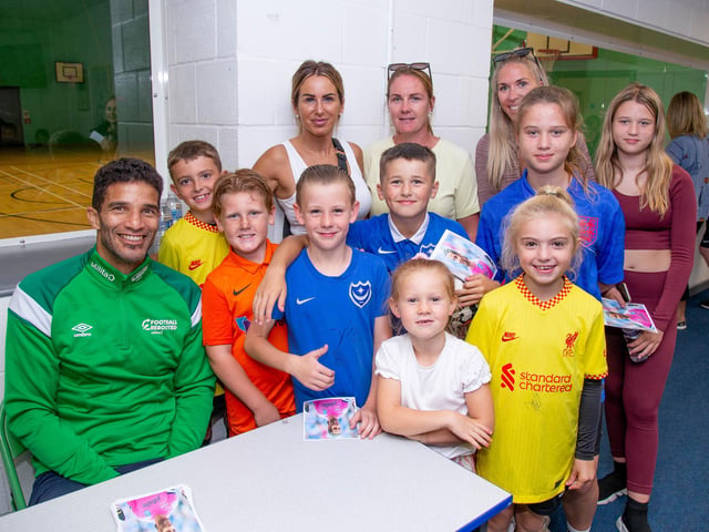 Pictured: David James with some of his fans at Bay School, Gosport