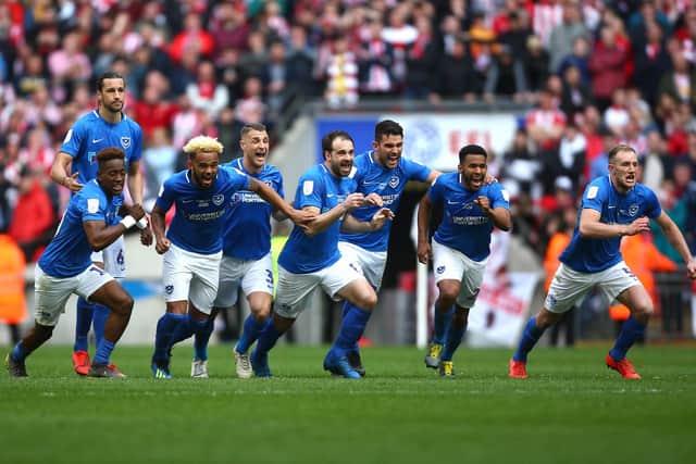 The Pompey players react to Oli Hawkins' winning penalty against Sunderland in last season's Checkatrade Trophy final.  Picture: Jordan Mansfield/Getty Images