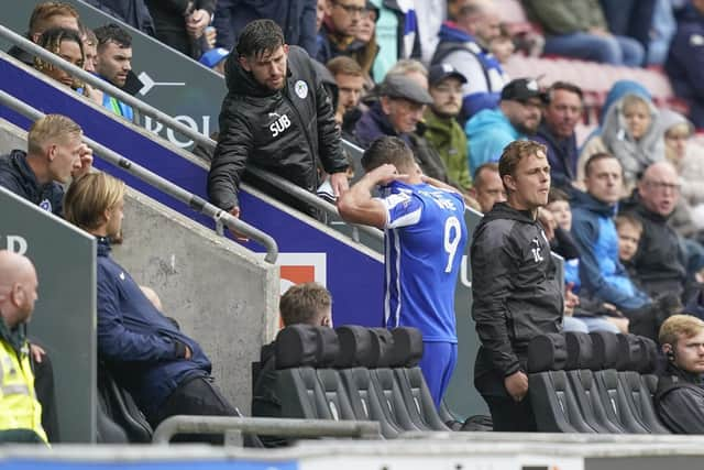 Charlie Wyke is sent off for a foul on Pompey's Marlon Pack at Wigan today. Pic: Jason Brown.