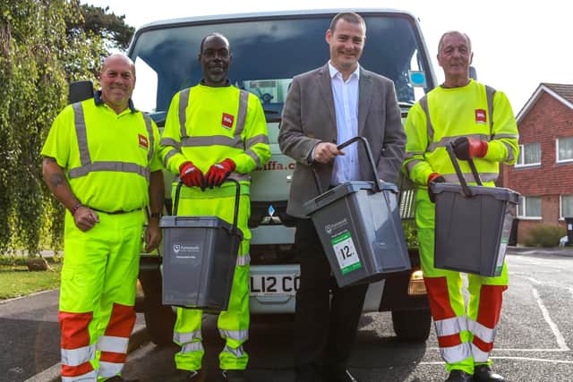 Portsmouth City Council workers and Cllr Dave Ashmore with the food caddies.