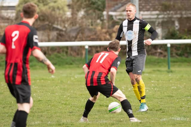Elliot Spencer, right, in action for Hayling United last season.  Picture: Keith Woodland
