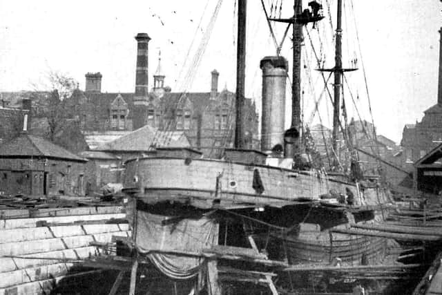 Captain Robert Falcon Scott's tall ship Discovery being refitted in the Vosper yard at the Camber in 1925. The dry dock was later used for unloading coal for the power station. 
Picture: Stephen Payne collection.