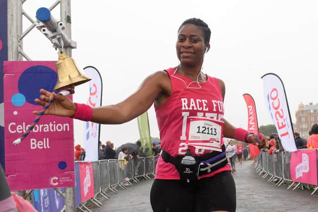 Finisher ringing the celebration bell at Race for Live 2019, Southsea. Picture: Keith Woodland (070719-371)