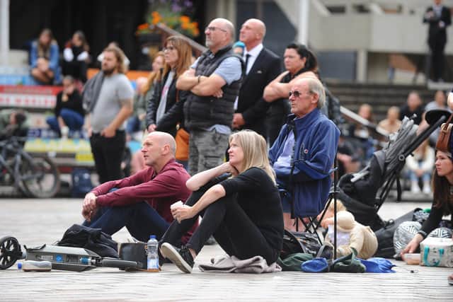 People gather in Guildhall Square to watch Queen Elizabeth's II funeral on the big screen.
Picture: Sarah Standing (190922-949)