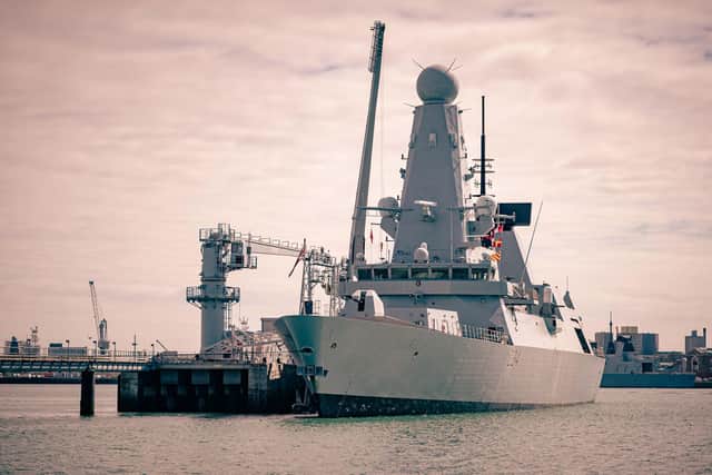 Type 45 destroyer HMS Diamond pictured alongside at the Upper Harbour Ammunition Facility in Portsmouth, where warships are rearmed safely. Photo: Royal Navy
