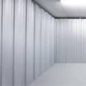 Empty garage sized storage unit awaiting donations