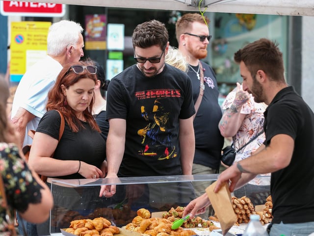 Choosing pastries. Southsea Food Festival on Palmerston, Clarendon and Osborne RoadsPicture: Chris  Moorhouse (200724-22)