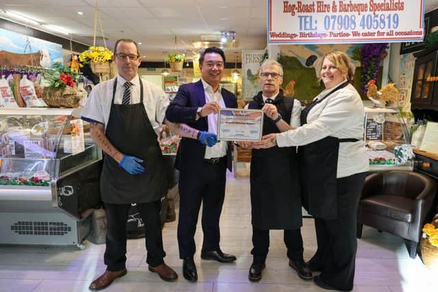 Alan Mak MP (second left) at Greywell Old School Butchers in Leigh Park with owner Gary Wright (second right) and members of his team Ellen and Fred Burgess