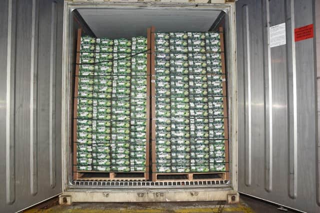 The crates of limes in the first container