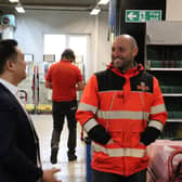 Alan Mak MP chats to a postal delivery worker at the Hayling Island Delivery Office