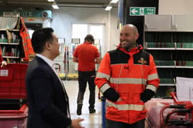 Alan Mak MP chats to a postal delivery worker at the Hayling Island Delivery Office