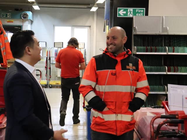 Alan Mak MP chats to a postal delivery worker at the Hayling Island Delivery Office