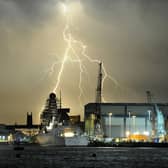 18th July 2014. A lightning thunderstorm passes over Portsmouth in the early hours of Friday Morning. Viewed from Gosport. Pictured is HMS Dauntless docked at the Portsmouth Naval base with the BAE shipyard right.
Picture: Paul Jacobs (142100-30)