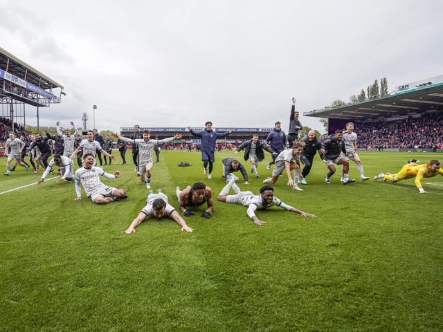 The League One title winners celebrate at the end of their 2-0 success at Lincoln in the final match of the 2023-24 season. Picture: Jason Brown/ProSportsImages