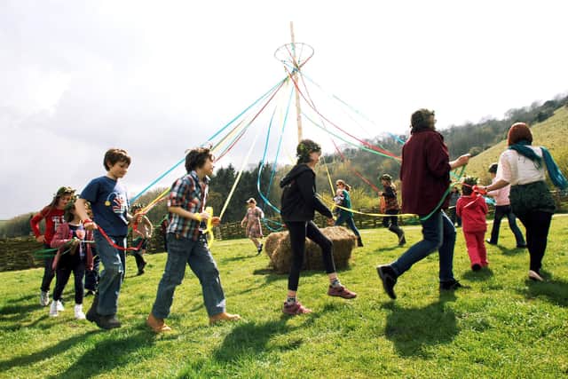 Butser Ancient Farm, Ostara - spring activity days for families - maypole dancing practice