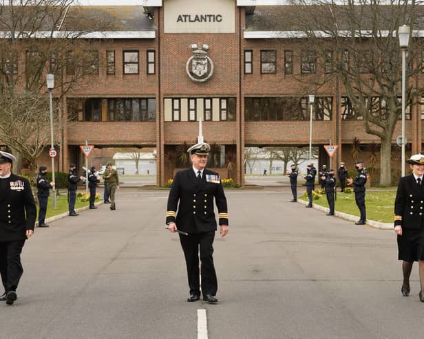 Commander Mark Walker, centre, executive officer at HMS Collingwood, pictured leaving the base for the final time with Surgeon Commander (Dentist) Julie Skelley, right ,and Reverend Mike Meachin, left. Photo: Keith Woodland