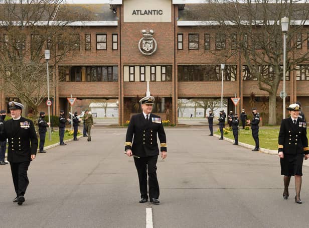 Commander Mark Walker, centre, executive officer at HMS Collingwood, pictured leaving the base for the final time with Surgeon Commander (Dentist) Julie Skelley, right ,and Reverend Mike Meachin, left. Photo: Keith Woodland