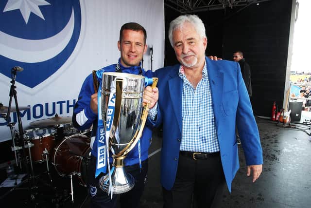Former Pompey chairman Iain McInnes, right, with ex-skipper Michael Doyle and the League Two trophy