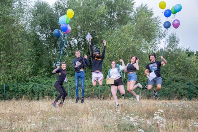Students celebrate by jumping in the air at Portsmouth College.
Picture: Habibur Rahman