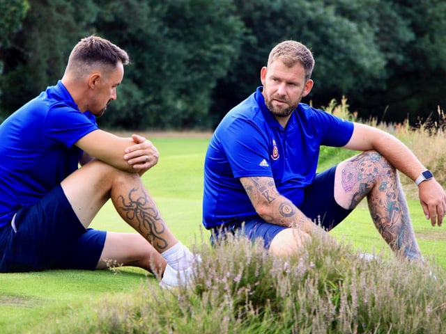 After losing their singles matchs, Hampshire pair Darren Walkley  and Sam Parsons await the scores at Hindhead. Picture: Andrew Griffin