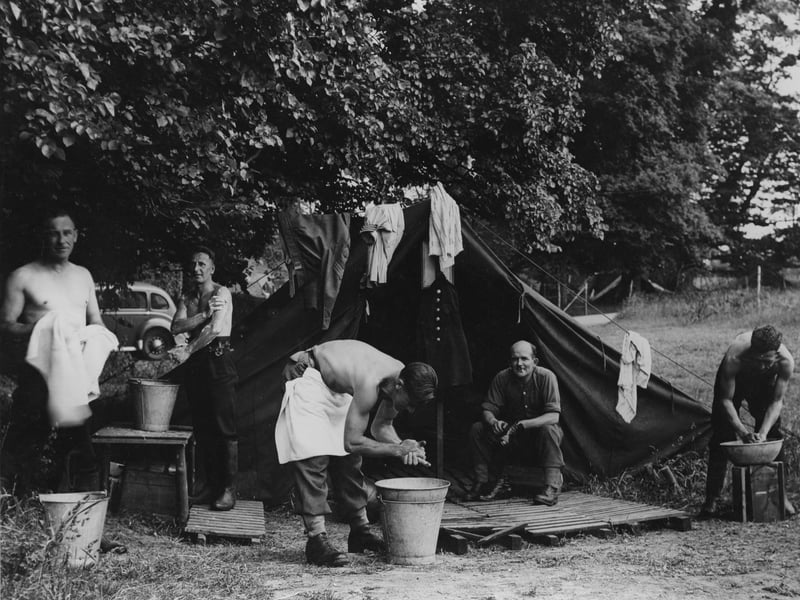 Civilian fireman at one of the D-Day troop camps near Portsmouth. They were there in case of fires caused by enemy bombing, to prevent that delaying the D-Day embarkation preparations. The image gives a good idea of the conditions that the troops lived under in these camps.