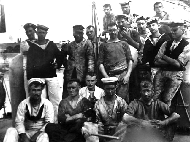 After coaling ship. Ships were all powered by furnaces.Here we see some of the crew from the turtle-back destroyer HMS Chamois. Bottom centre of the photograph is the ships pet and to the left of it is George Harwood. He was the grandfather of George Millener who loaned us the photographs. Picture: George Millener collection