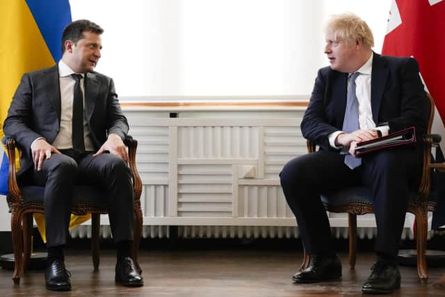 Ukrainian President Volodymyr Zelenskyy attends a meeting with Prime Minister Boris Johnson at the Munich Security Conference in Germany over the weekend