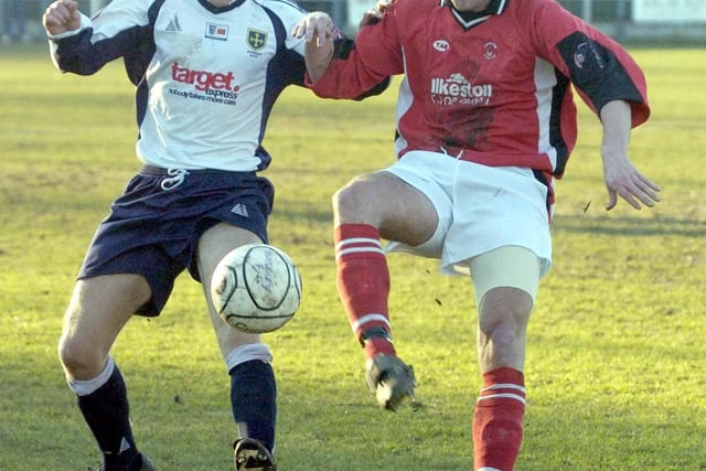 Ilkeston's Lee Soar tries to get to the ball first at Guiseley.