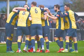 Steve Hutchings is mobbed after putting Moneyfields into a first minute lead against Truro City. Pic: Martyn White.