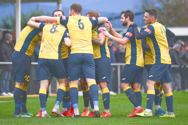 Steve Hutchings is mobbed after putting Moneyfields into a first minute lead against Truro City. Pic: Martyn White.