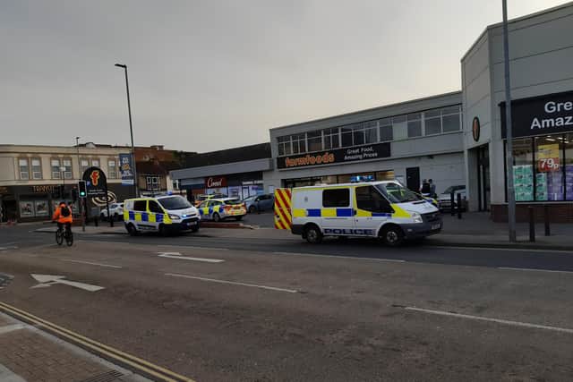 Six police vehicles were seen outside Farmfoods, Fratton Road, at the time of the arrest.