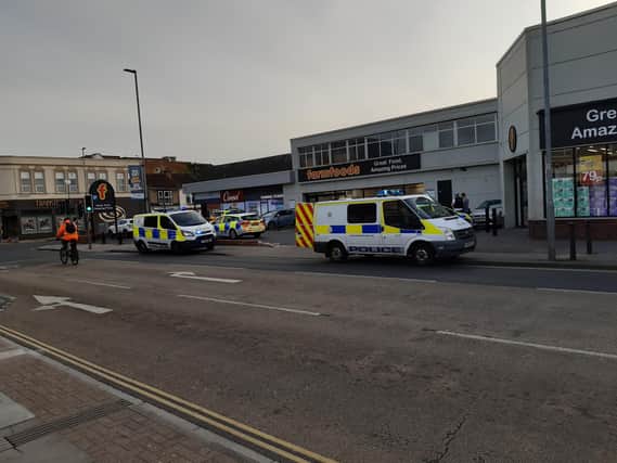 Six police vehicles were seen outside Farmfoods, Fratton Road, at the time of the arrest.
