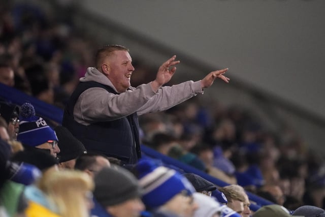 Pompey fans backed their team to a crucial Championship survival win over Cardiff last night.