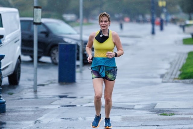 Runners hit the streets in wet and windy conditions despite The Great South Run being cancelled.