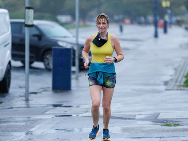 Runners hit the streets in wet and windy conditions despite The Great South Run being cancelled.