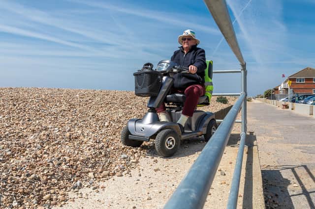 Rod Hall (80) at the top of the accessibility ramp on Hayling Island beach. Picture: Mike Cooter
