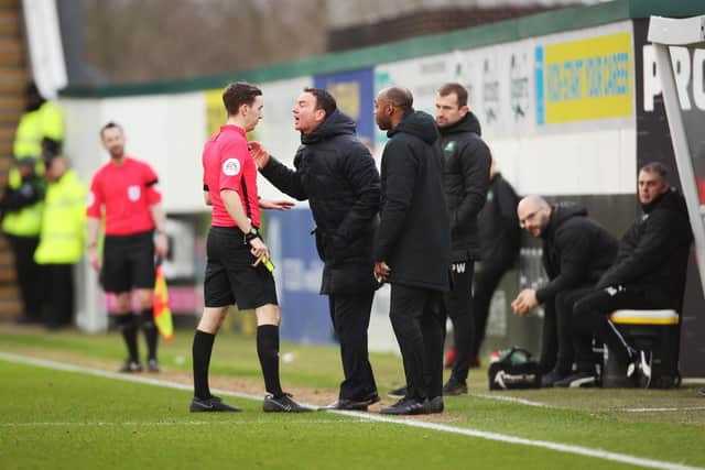 Plymouth boss Derek Adams is shown a yellow card for arguing with the referee in their February 2019 clash with Pompey. Picture: Joe Pepler