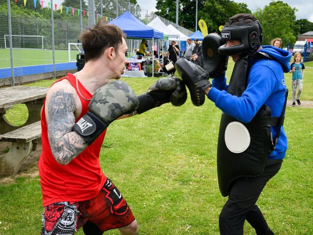 Pictured is: Curtis Thatcher spars with Dave McAllister of the Gosport Boxing Club
Picture: Keith Woodland (080621-25)