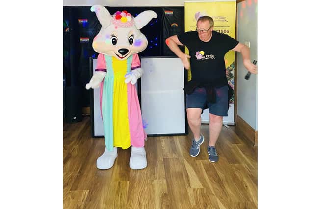 Justin Pannell, of Children's Parties Portsmouth, cutting some shapes with Bella the Bunny for the Carlton Club's Easter party.
