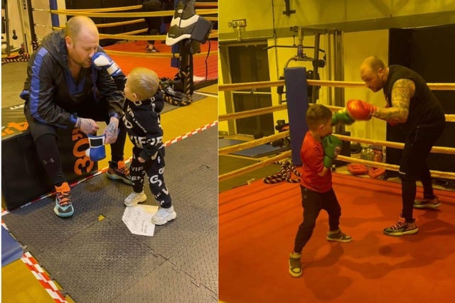 Dean boxing with his sons at the padathon event.