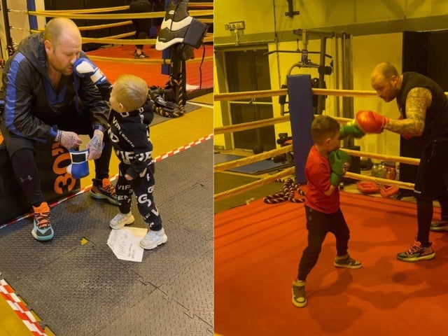 Dean boxing with his sons at the padathon event.