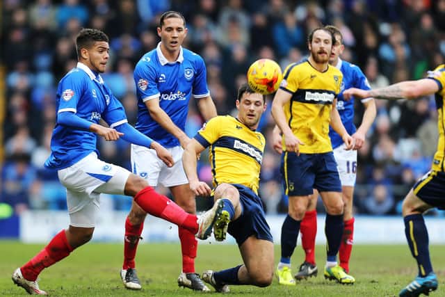 Joe Devera and Josh Passley (left) battle for possession against Oxford United in February 2012. Picture: Joe Pepler