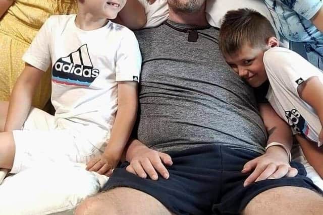 Adam with his family in hospital. 