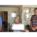 Lee-on-the-Solent resident David Gray has donated £2,000 to help the closed library in the area be turned into Lee Hub. Pictured: Cllr John Beavis, David Gray and Cllr Graham Burgess