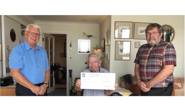 Lee-on-the-Solent resident David Gray has donated £2,000 to help the closed library in the area be turned into Lee Hub. Pictured: Cllr John Beavis, David Gray and Cllr Graham Burgess