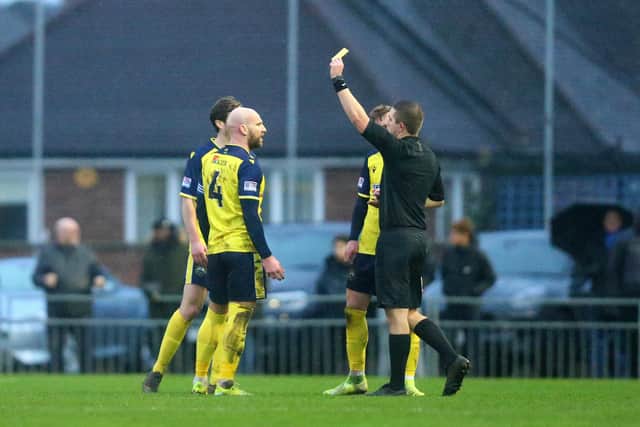 Mike Carter picks up a first half booking. Picture: Chris Moorhouse