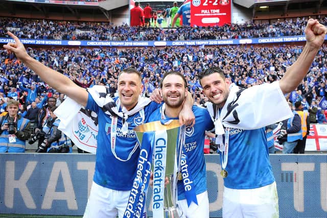 Gareth Evans, right. is joined by Lee Brown and Brett Pitman for post-match celebrations after capturing the Checkatrade Trophy in March 2019. Picture: Joe Pepler