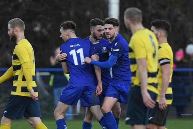 Harry Sargeant is congratulated by his Baffins team-mates after his equaliser against Hamworthy. Picture: Neil Marshall