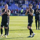 Ryan Tunnicliffe and Joe Rafferty applaud travelling Pompey fans after a disappointing result at Shrewsbury. Picture: Jason Brown/ProSportsImages